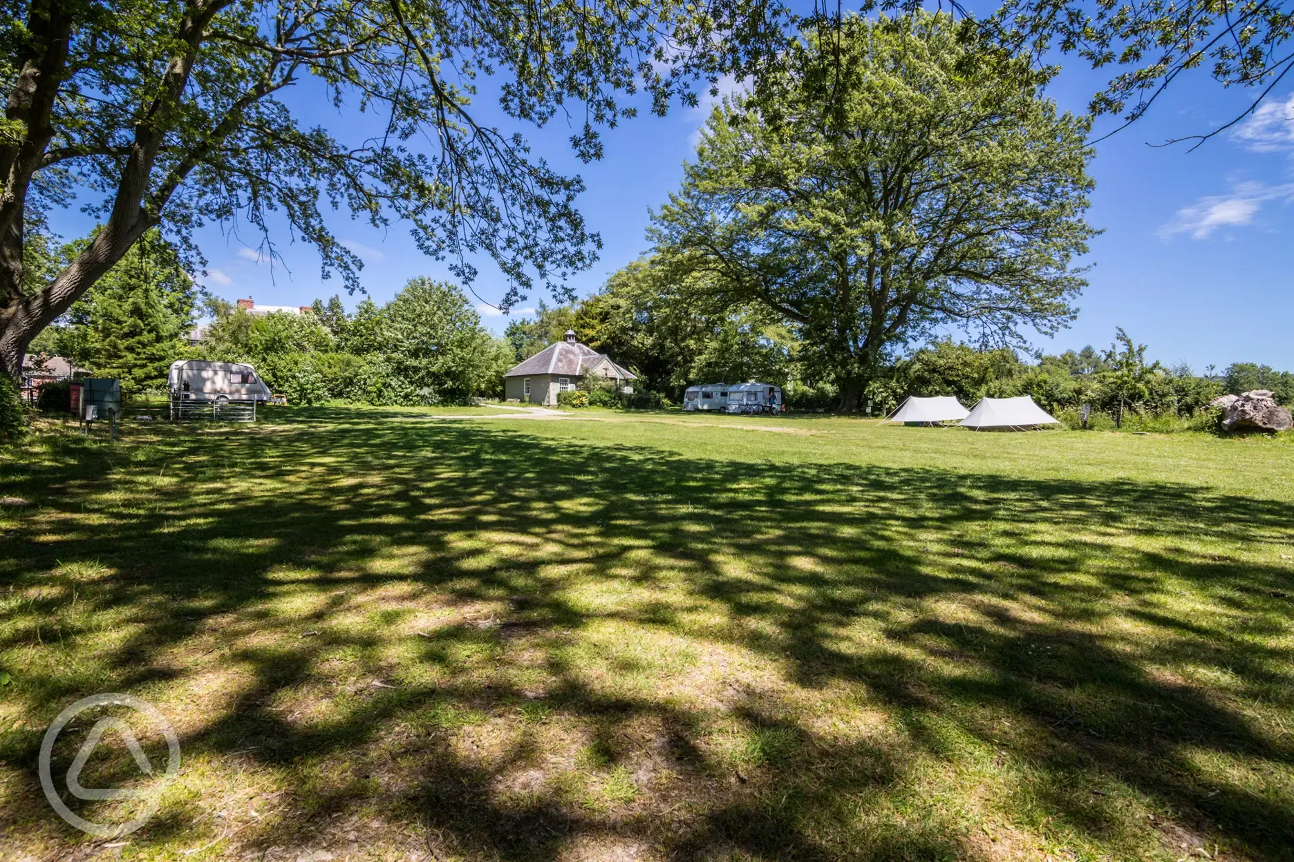 Quiet camp site with facilities in background