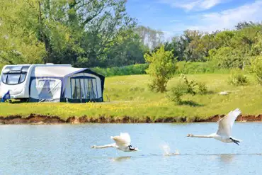 Optional electric grass pitches by the coarse fishing lake