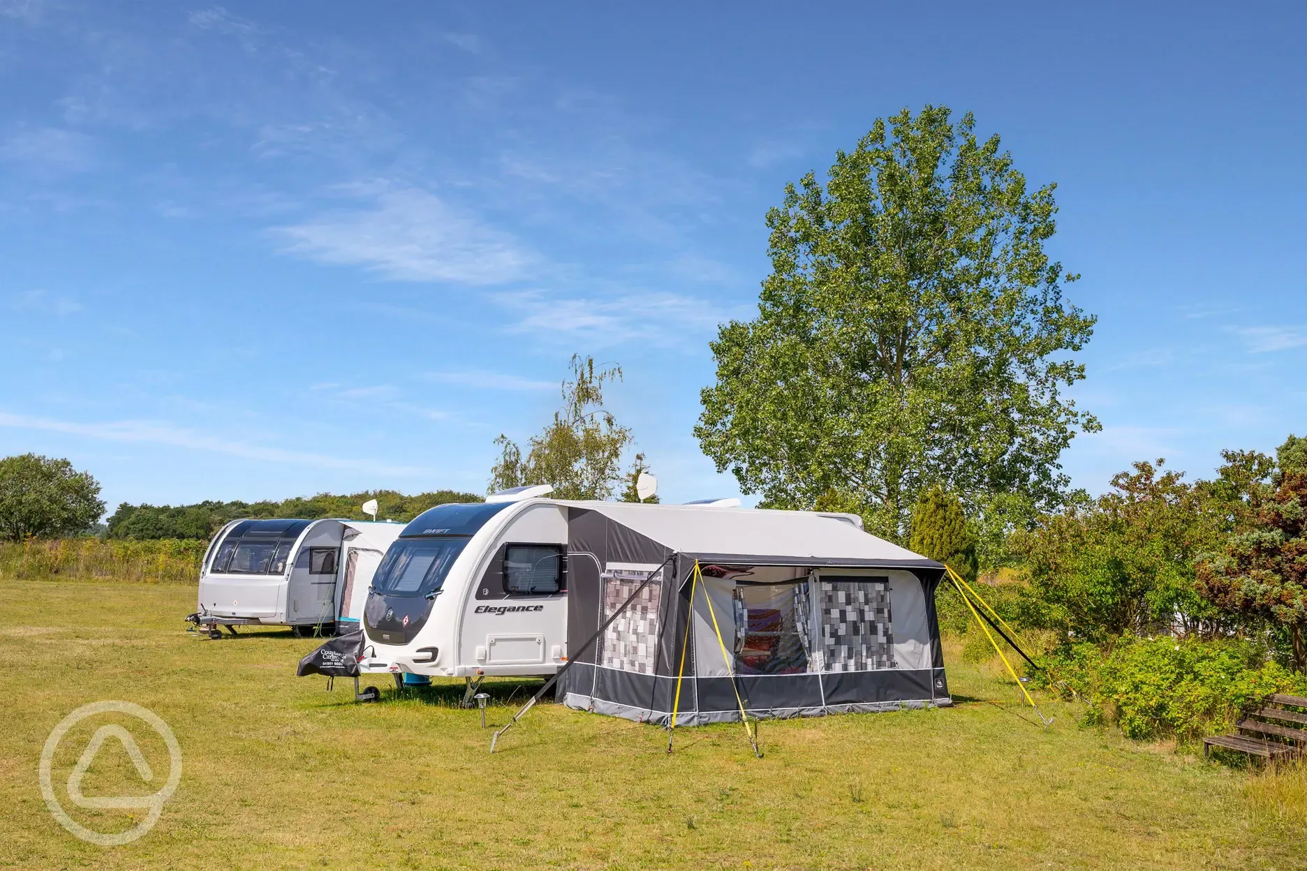 Caravans on optional electric grass pitches with awning space Caravans on optional electric grass pitches with awning space