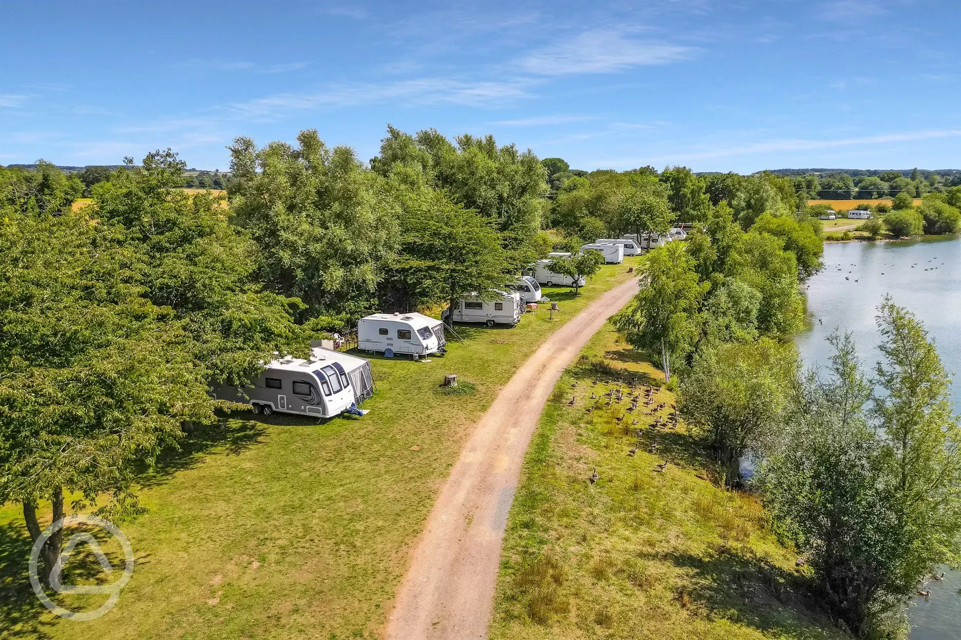 Optional electric grass pitches beside the fishing lake at Gatton Waters Optional electric grass pitches beside the fishing lake at Gatton Waters