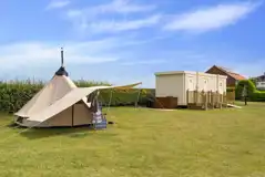 Non electric grass pitches beside the facility block