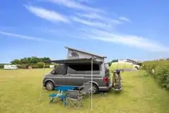 Campervan on an electric grass pitches with a 16 amp hook up