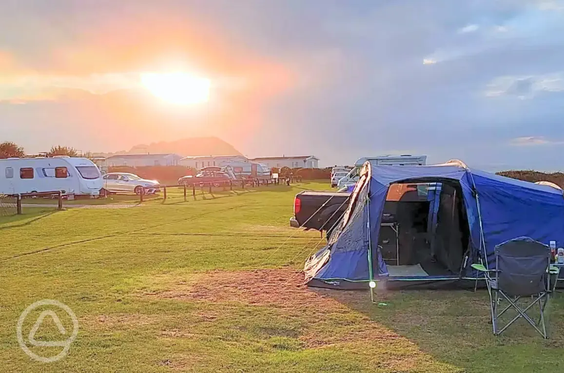 Electric grass pitches in the Church Field at sunset