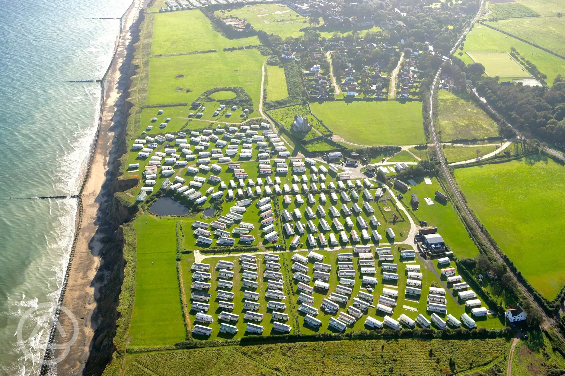 Aerial of Beeston Regis Holiday Park, on a clifftop overlooking the coast
