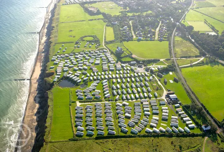 Aerial of Beeston Regis Holiday Park, on a clifftop overlooking the coast