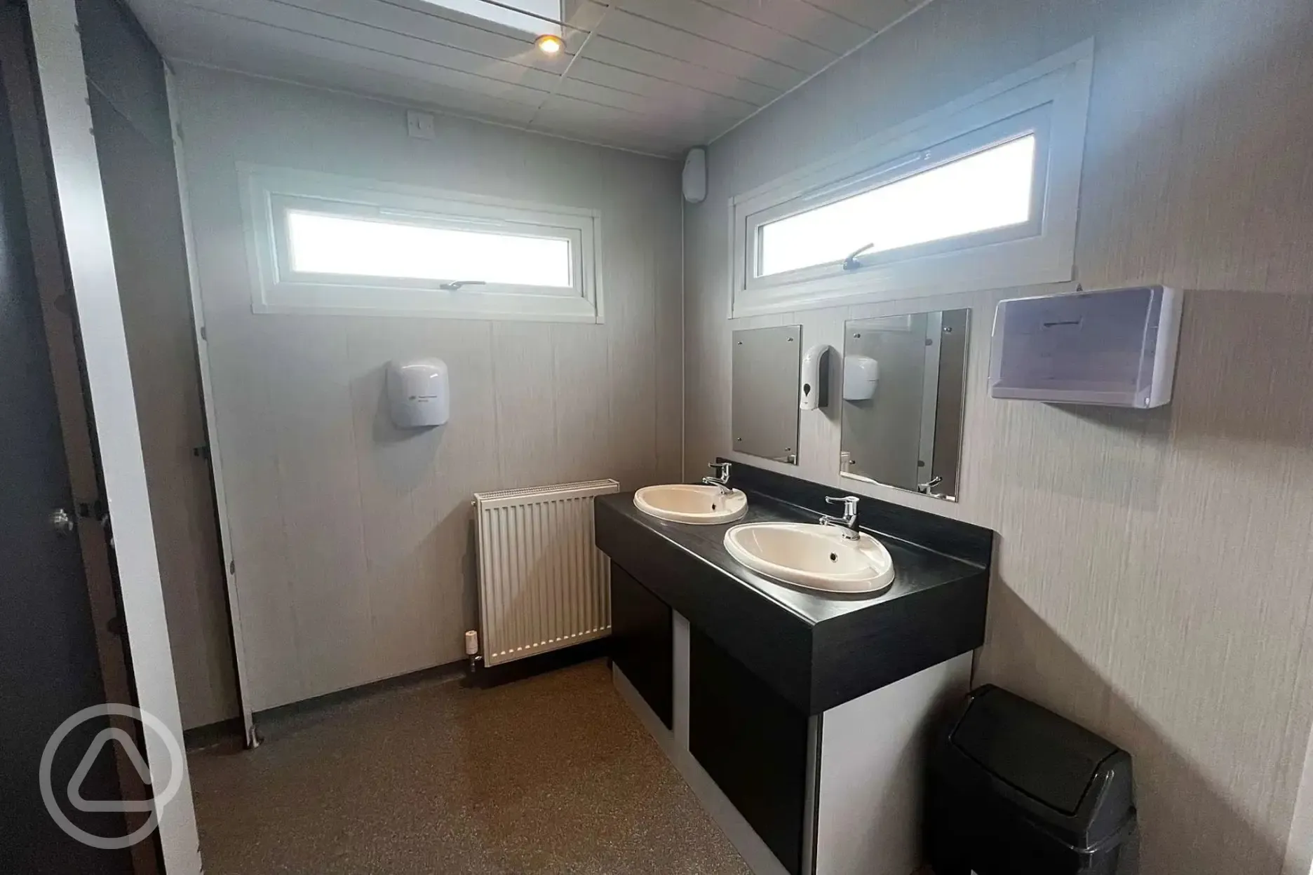Facilities block interior with sinks and mirrors