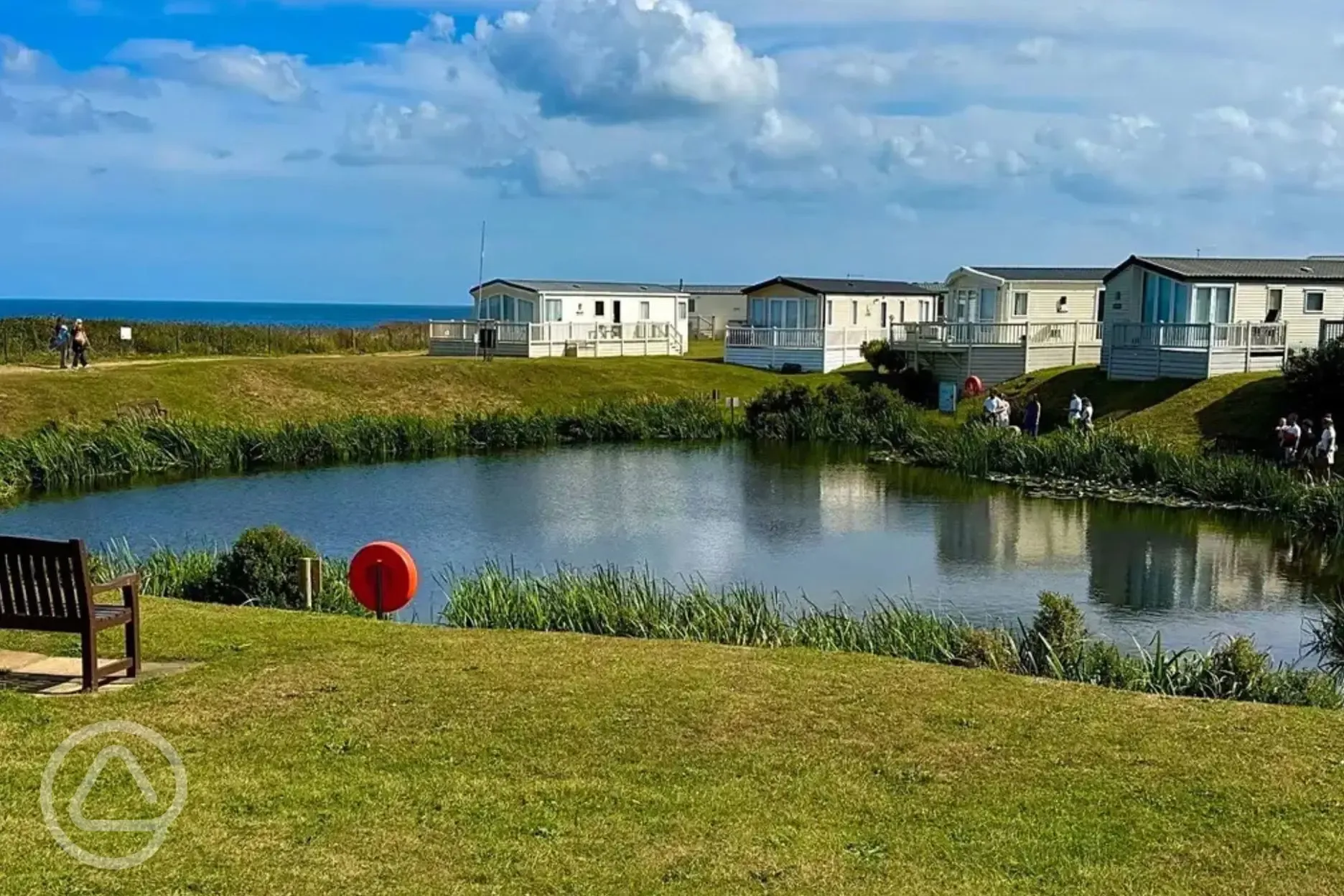 Fishing lake with static caravans behind