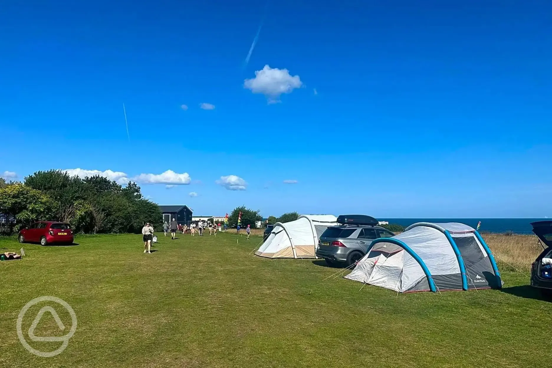 Non electric grass pitches with facilities block behind