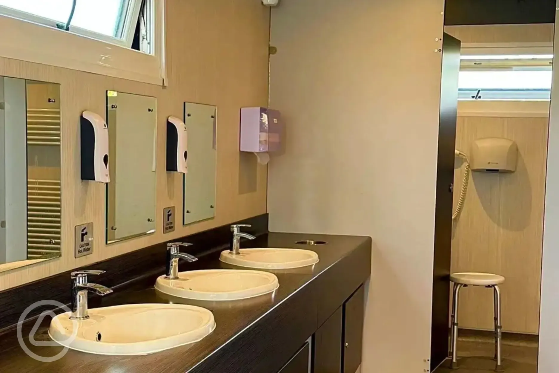Toilets and showers with sinks and mirrors