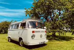 VW campervan on an electric grass pitch