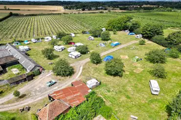 Aerial of Painters Farm Campsite overlooking the pitches and cherry orchards