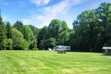 Grass caravan pitches with a 16 amp hook up at Folly Farm Caravan and Camping 
