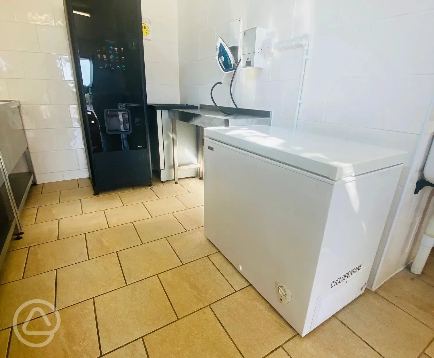 Laundry room with iron and communal freezer