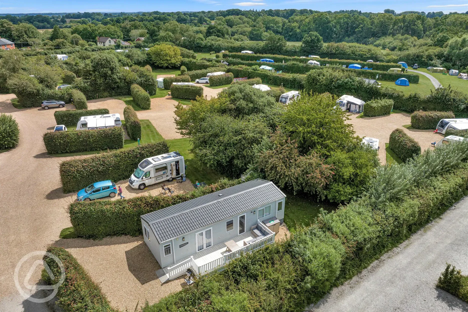 Aerial of the lodges and camping areas with hedges between