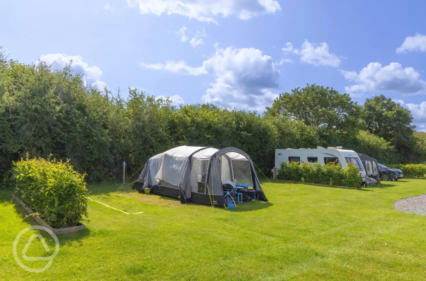 Fully serviced grass pitches with electric, water and grey waste outlet