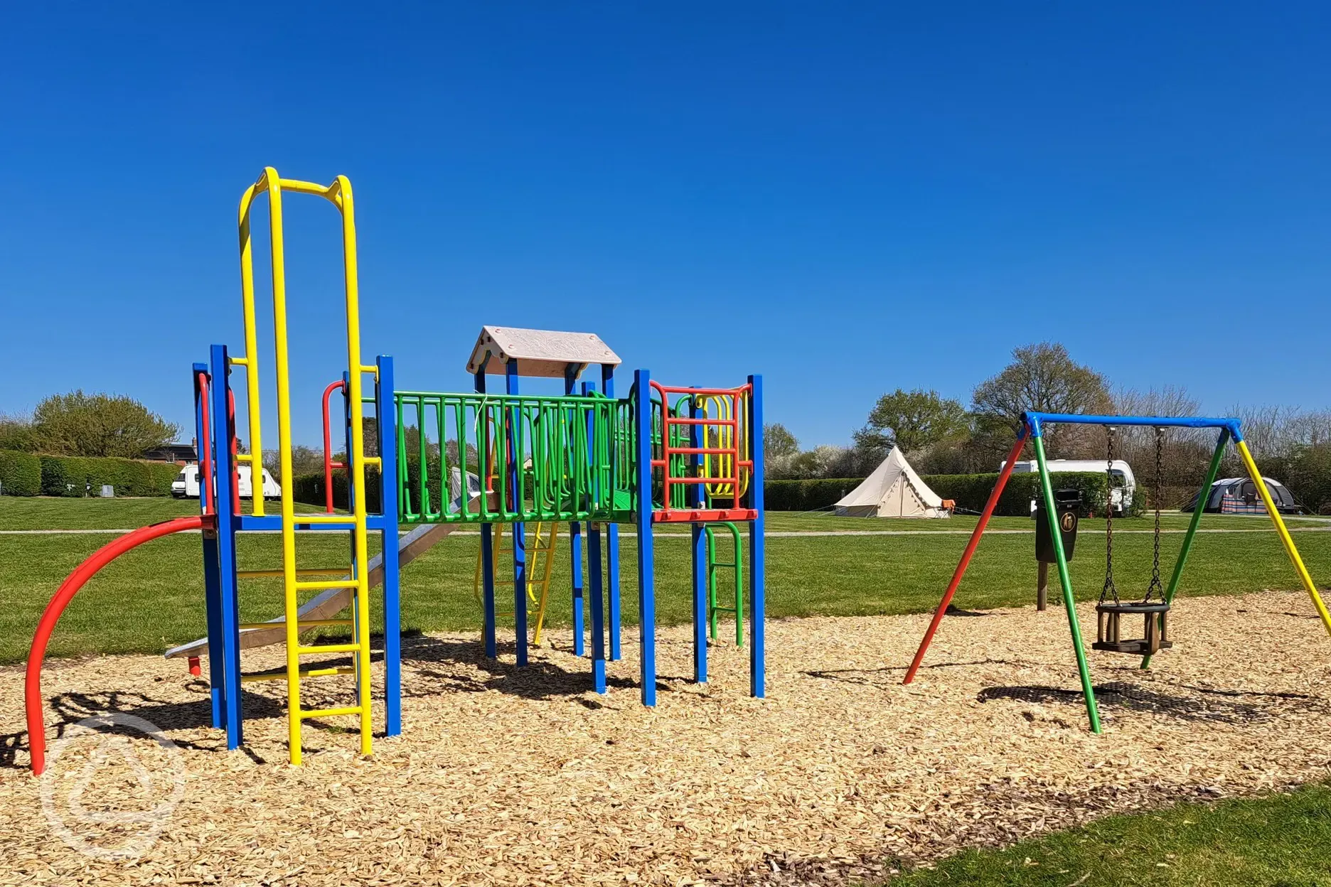 Small play area with a climbing frame and swing