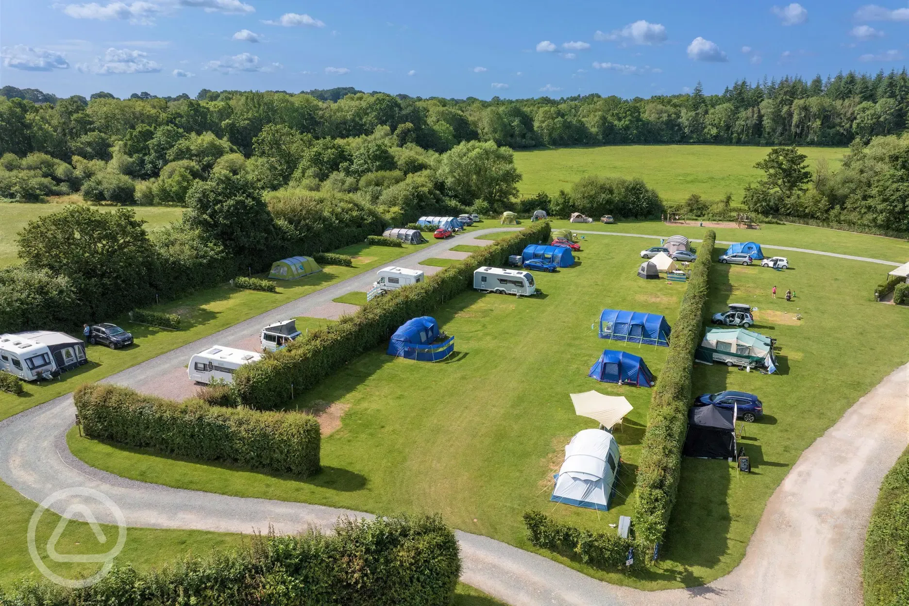 Aerial of the grass pitches with hedging between rows