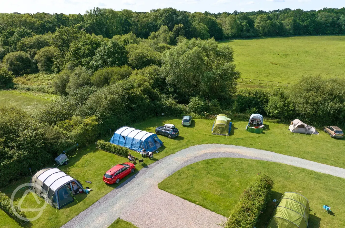 Aerial of the grass pitches backed by trees and hedges