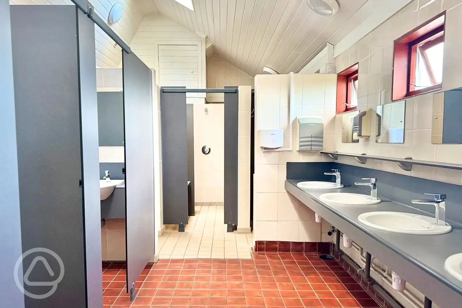 Bathrooms with hand basins and hair dryers