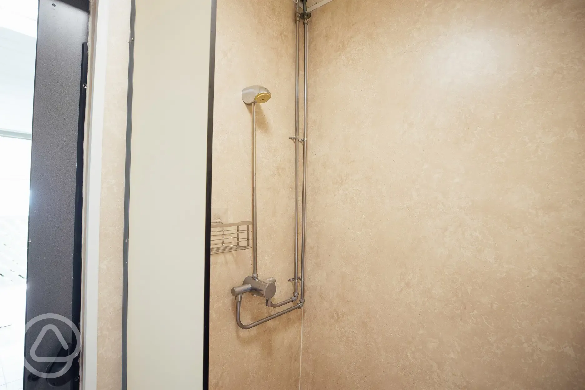 Shower cubicles with a bench and room for getting changed