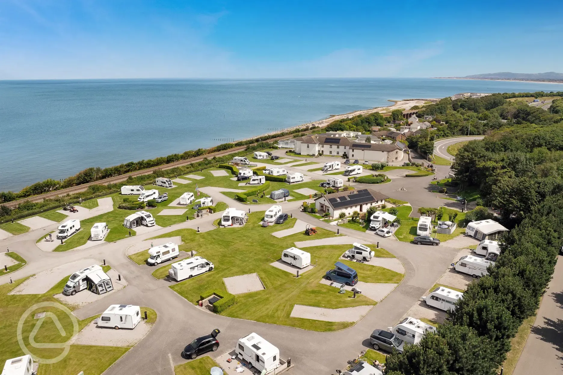 Aerial of the hardstanding pitches by the beach