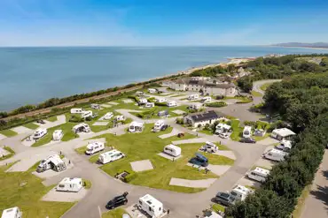 Aerial of the hardstanding pitches by the beach