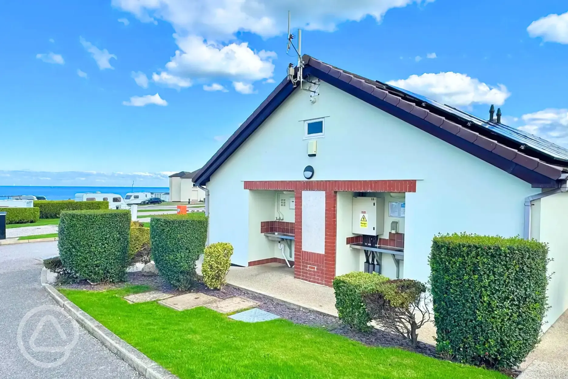 Facilities block with an outdoor washing up area