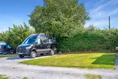 Electric hardstanding and grass pitch with 16 amp hook up and water access