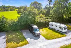 Electric hardstanding and small grass pitches measuring 10m by 10m