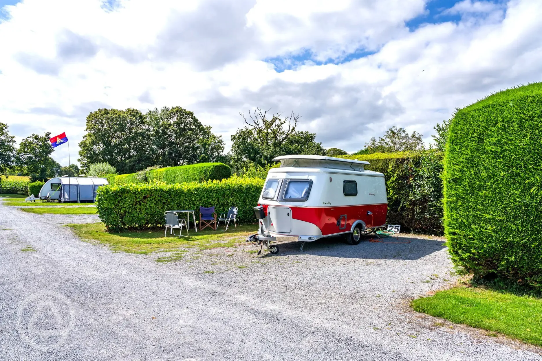 Electric hardstanding and small grass pitch