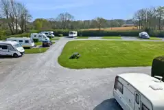 Electric hardstanding and grass pitches measuring 10m