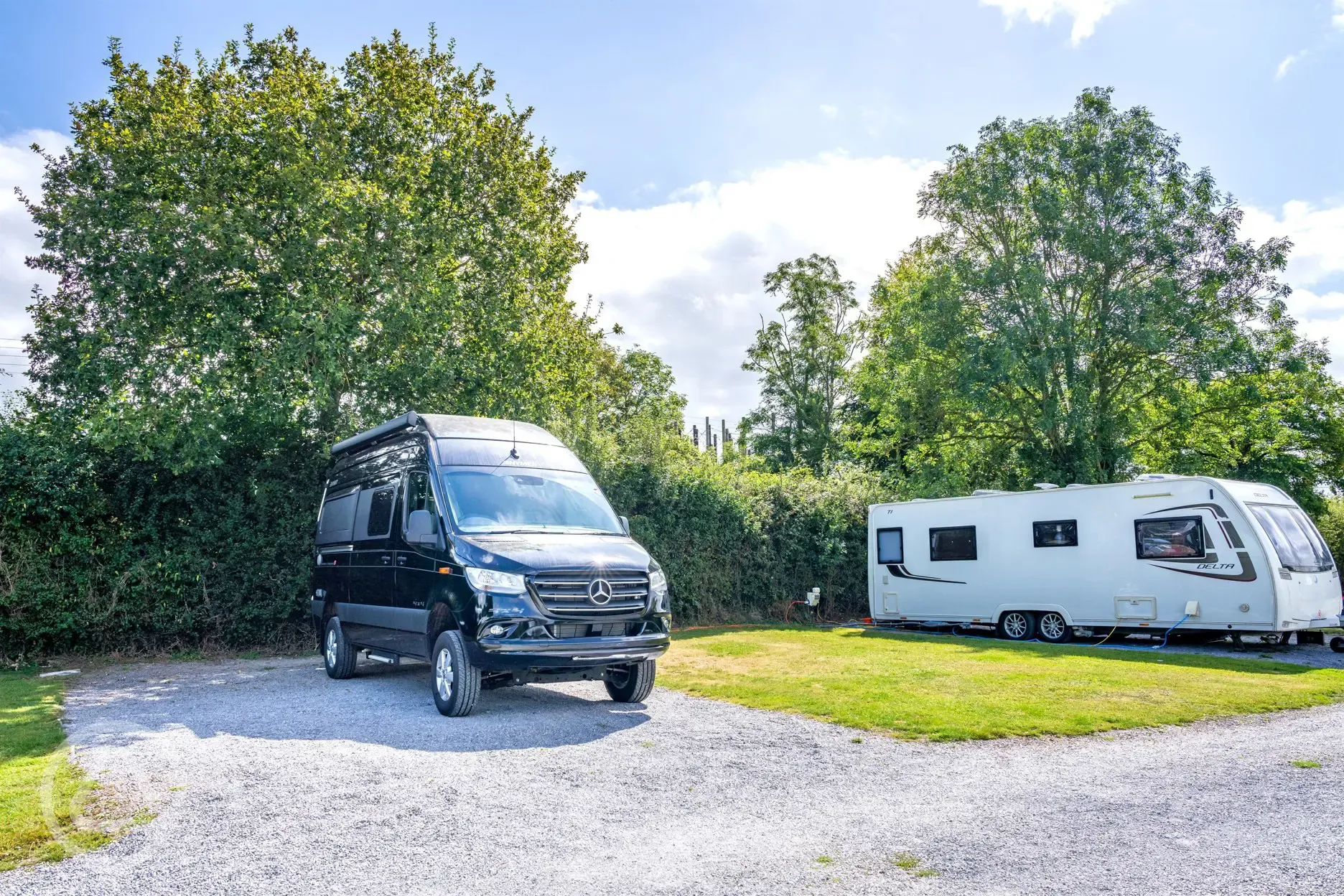 Electric hardstanding and grass pitch