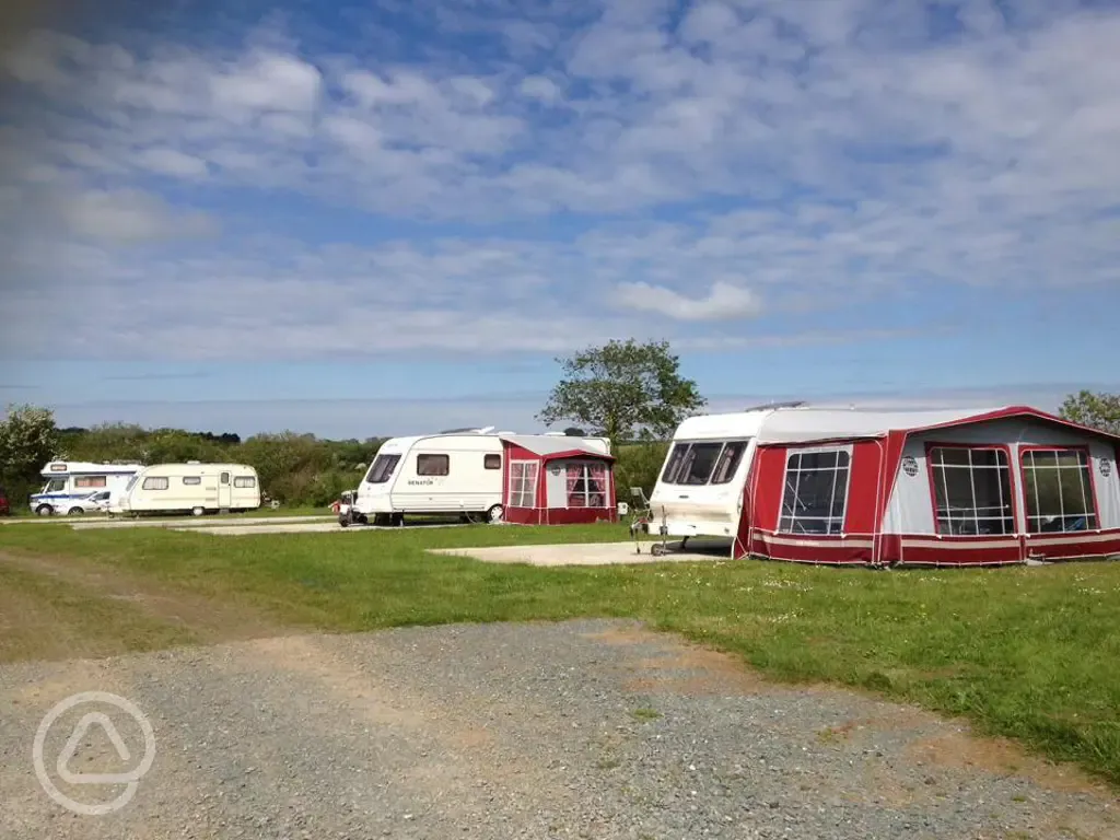 Electric hardstanding and grass pitches