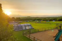 Noteworthy Farm Caravan and Campsite grass pitches and play area