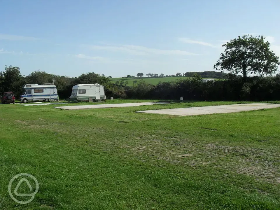 Electric hardstanding and grass pitches