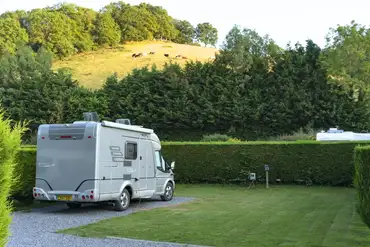 Hardstanding and grass pitches with hedges between for privacy (16 amp electric)