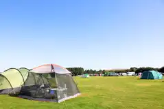 Grass pitches with space for a parked car at Moorland View Park
