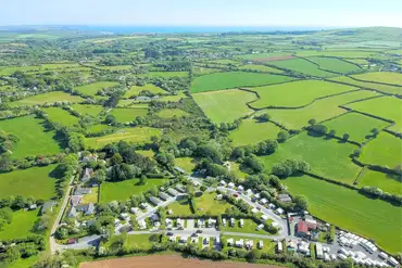Aerial of Polladras Holiday Park with views towards Praa Sands Beach