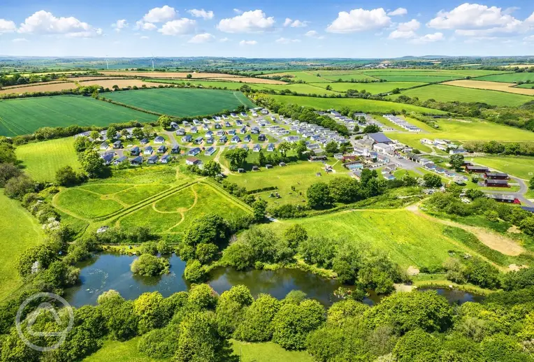 Aerial of Meadow Lakes Holiday Park with a mown dog walk area