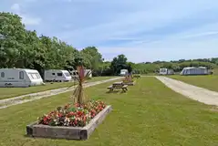 Electric grass pitches measuring 10m by 10m at Meadow Lakes Holiday Park Electric grass pitches measuring 10m by 10m at Meadow Lakes Holiday Park