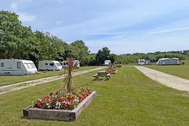 Electric grass pitches measuring 10m x 10m at Meadow Lakes Holiday Park