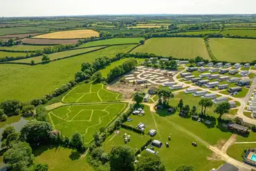 Aerial of Meadow Lakes Holiday Park with a mown dog walk area