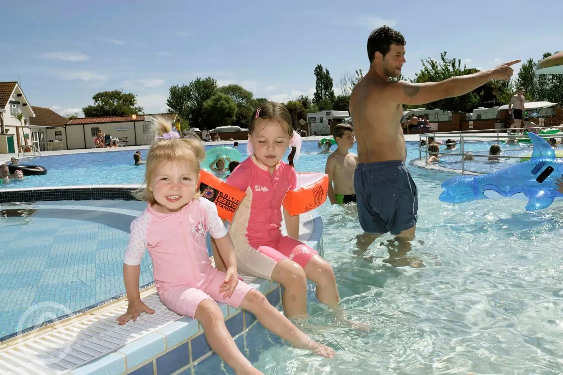 Outdoor heated swimming pool with a toddler's play pool