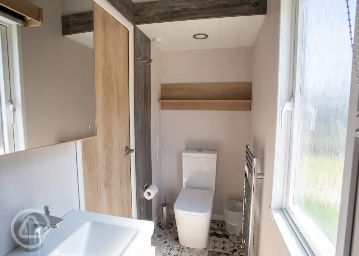 Studio pod cabins ensuite with a heated towel rail