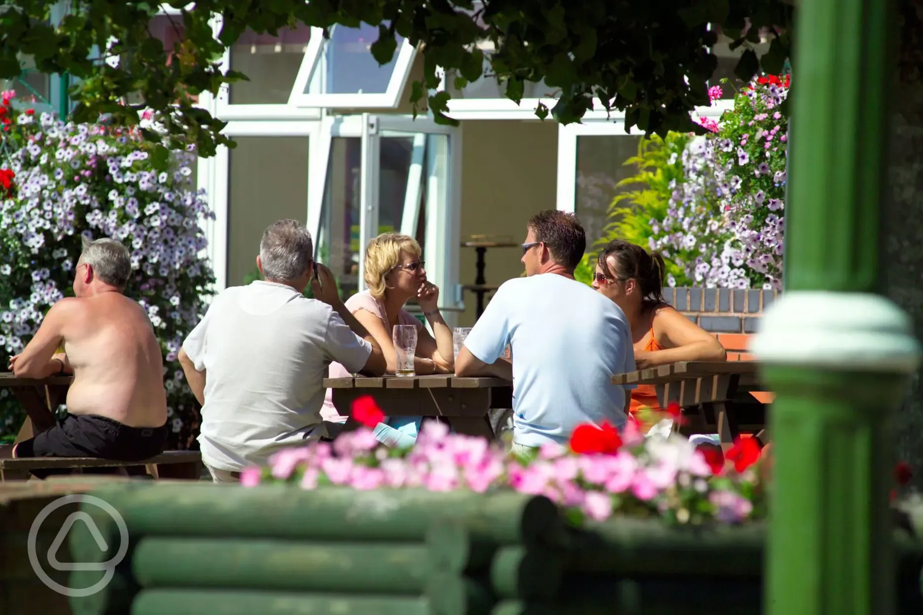Entertainment venue outdoor seating area at Home Farm Holiday Park
