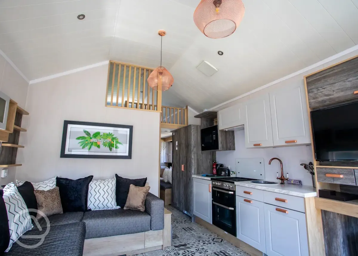 Studio pod cabin living area with a fold out bed