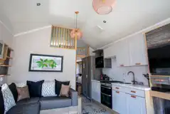 Studio pod cabin living area with a fold out bed Studio pod cabin living area with a fold out bed