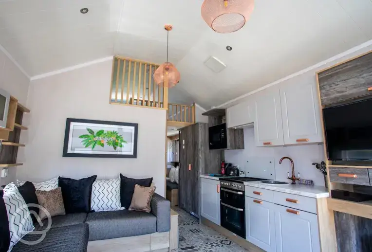 Studio pod cabin living area with a fold out bed