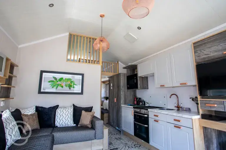 Studio pod cabin living area with a fold out bed