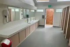 Female toilets with a communal hair dryer